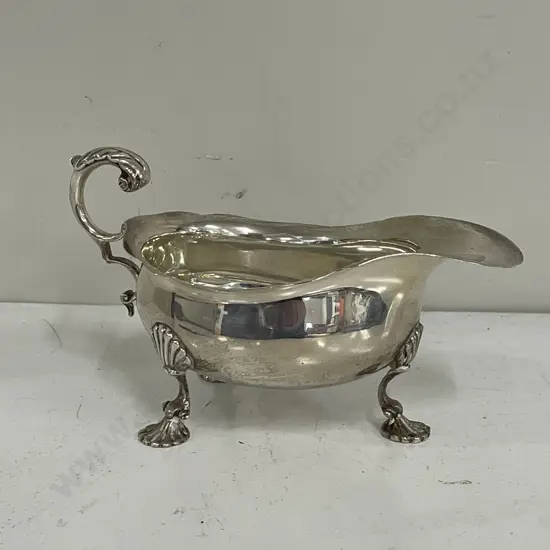 Sterling Silver Harrods 3 footed jug. Hallmarked as shown