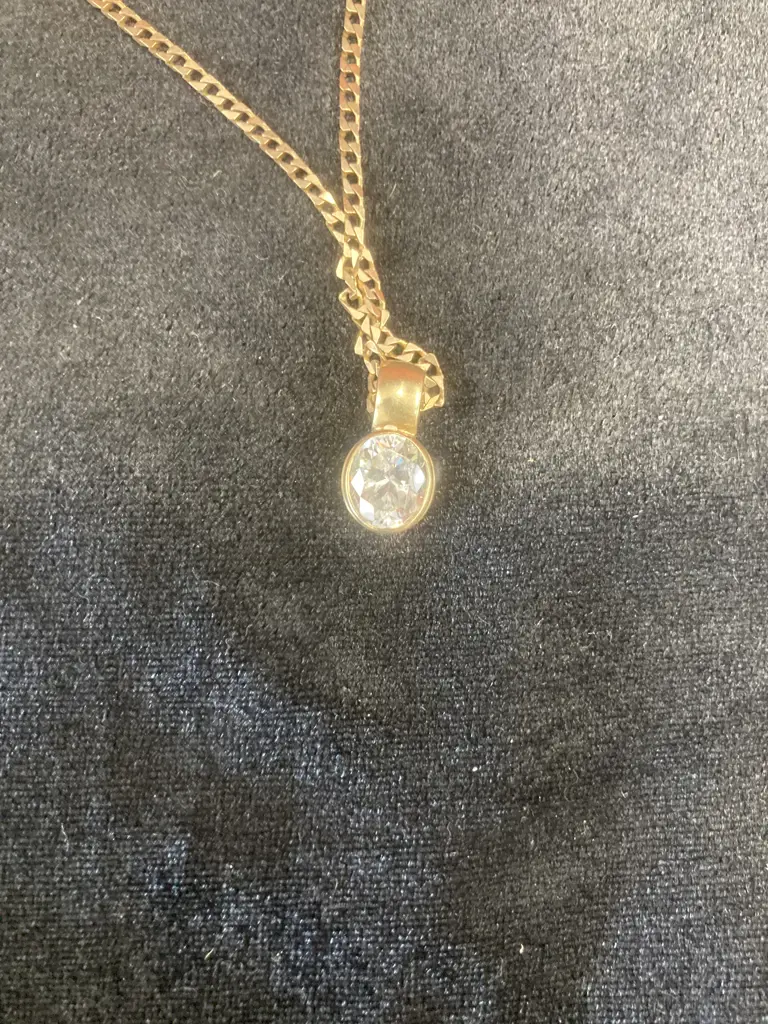 Oval Pendant With Clear Sparkling Stone On Gold Chain (Chain Stamped 375, Pendant Stamped 9ct) Image 1++