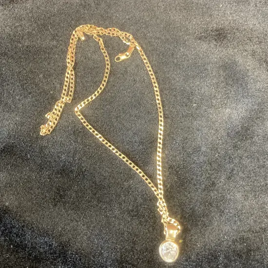 Oval Pendant With Clear Sparkling Stone On Gold Chain (Chain Stamped 375, Pendant Stamped 9ct)