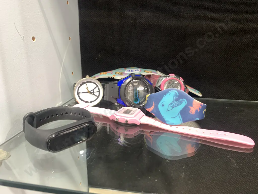 Selection of Six Watches And a Fitness Tracker Image 1++