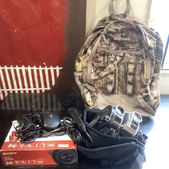 Cold Water Canyon Backpack, Sony 3-Way Car Speakers In Box, Panasonic DVD Video Camera, Sony Handycam Etc