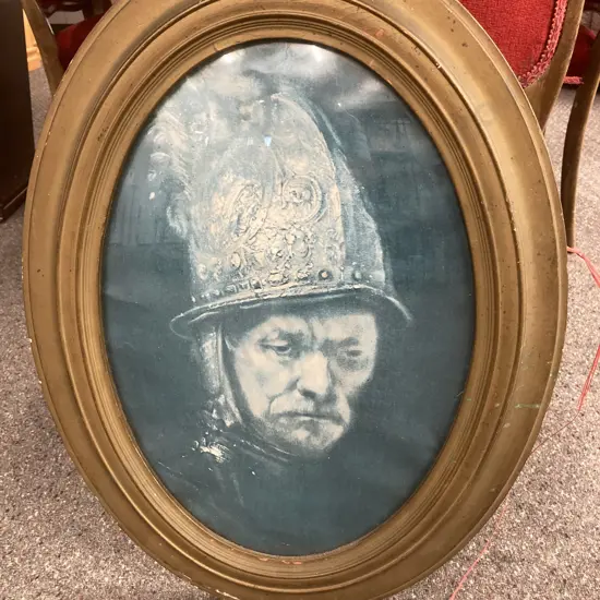 Oval Wooden Framed Print Of Man With Golden Helmet H63cm, W48cm.