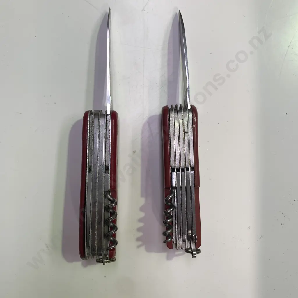 Victorinox Swiss Army Knife with one other Stainless Steel Pocket Knife Image 1++