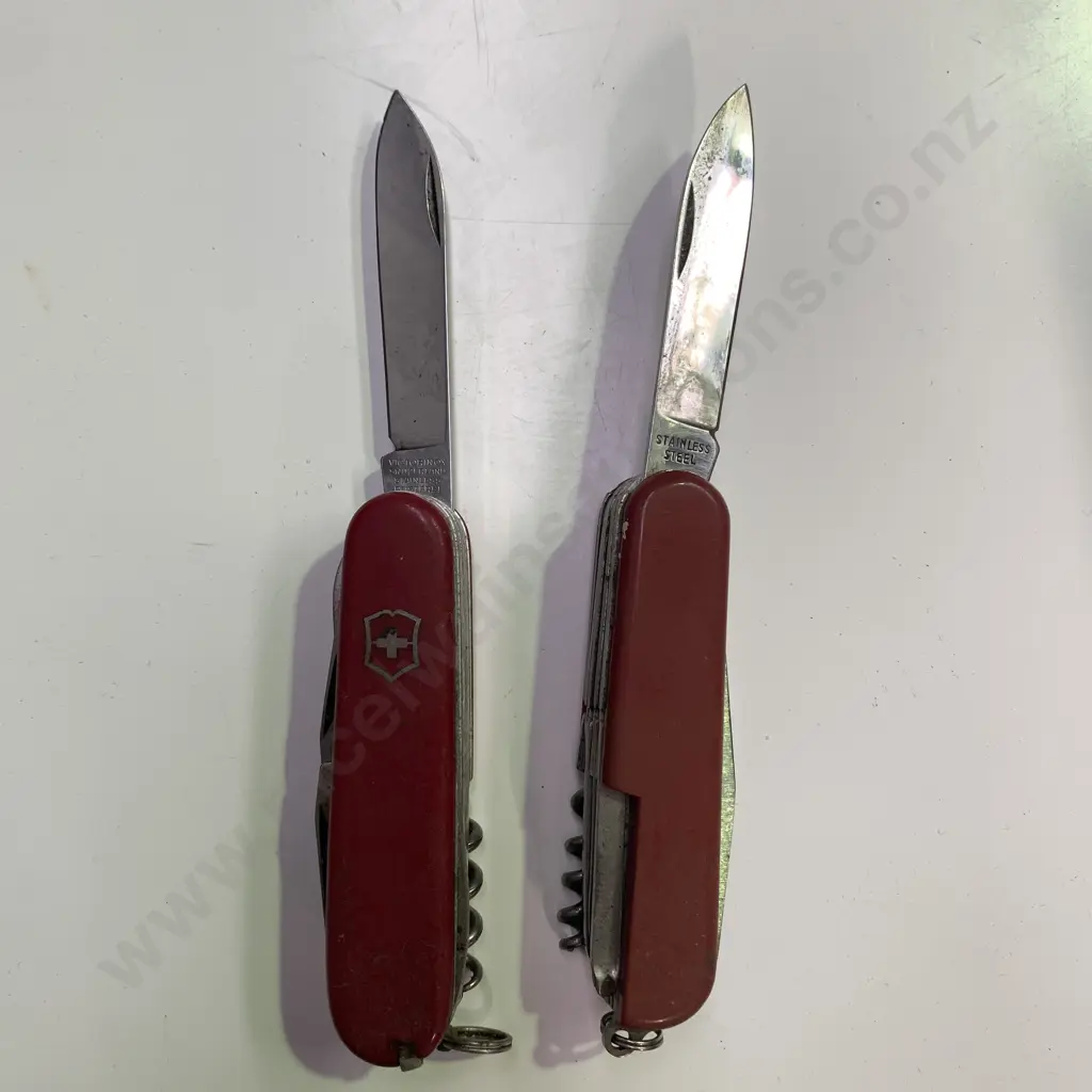 Victorinox Swiss Army Knife with one other Stainless Steel Pocket Knife Image 1++