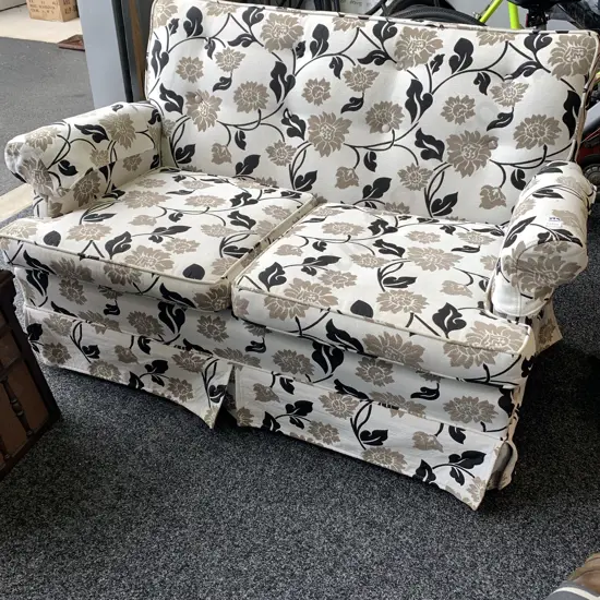 Vintage Style two Seater Couch. Black, fawn and cream patterned fabric. H78 W130 D80