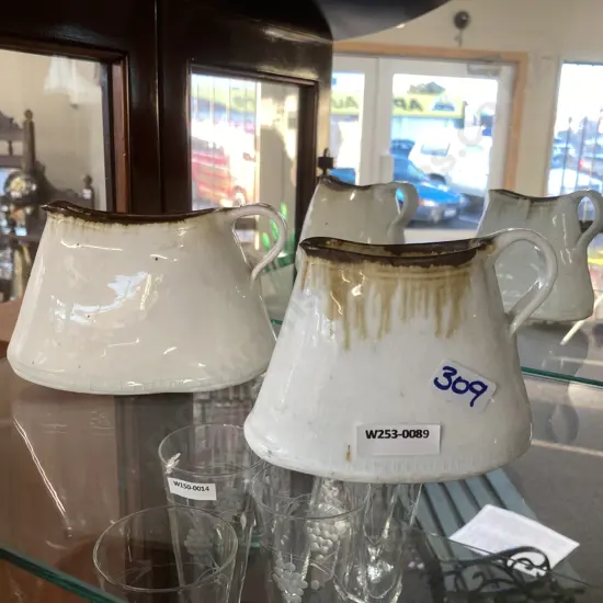 Pair Of Pottery Jugs 1x 10cm, 1x 14cm.