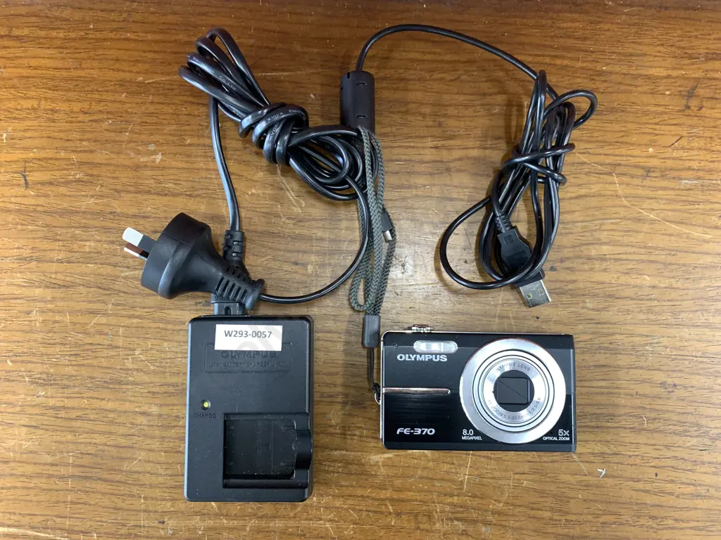 Olympus FE370 8MP Digital Camera with 5x Optical Dual Image Stabilized Zoom (Black), Charger & Lead Image 1++