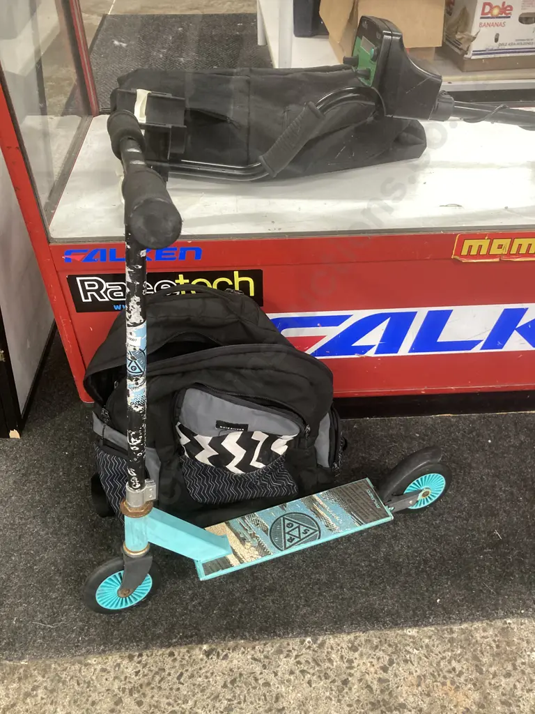 Black Quiksilver Backpack With A Green Milazo RGS Kids Scooter Image 1++