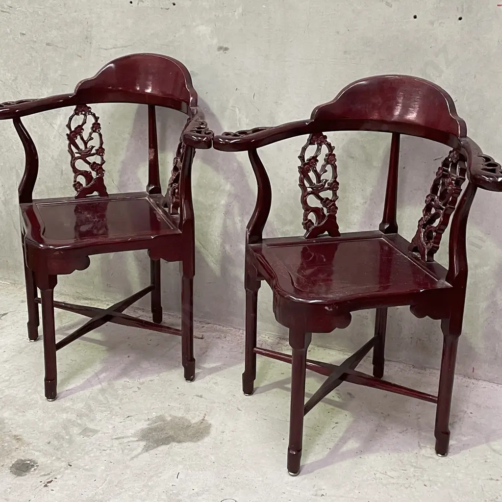 Pair of Vintage Chinese Rosewood Armchairs. Cross base with oval high back plate and intricately carved panels and arms. Image 1++