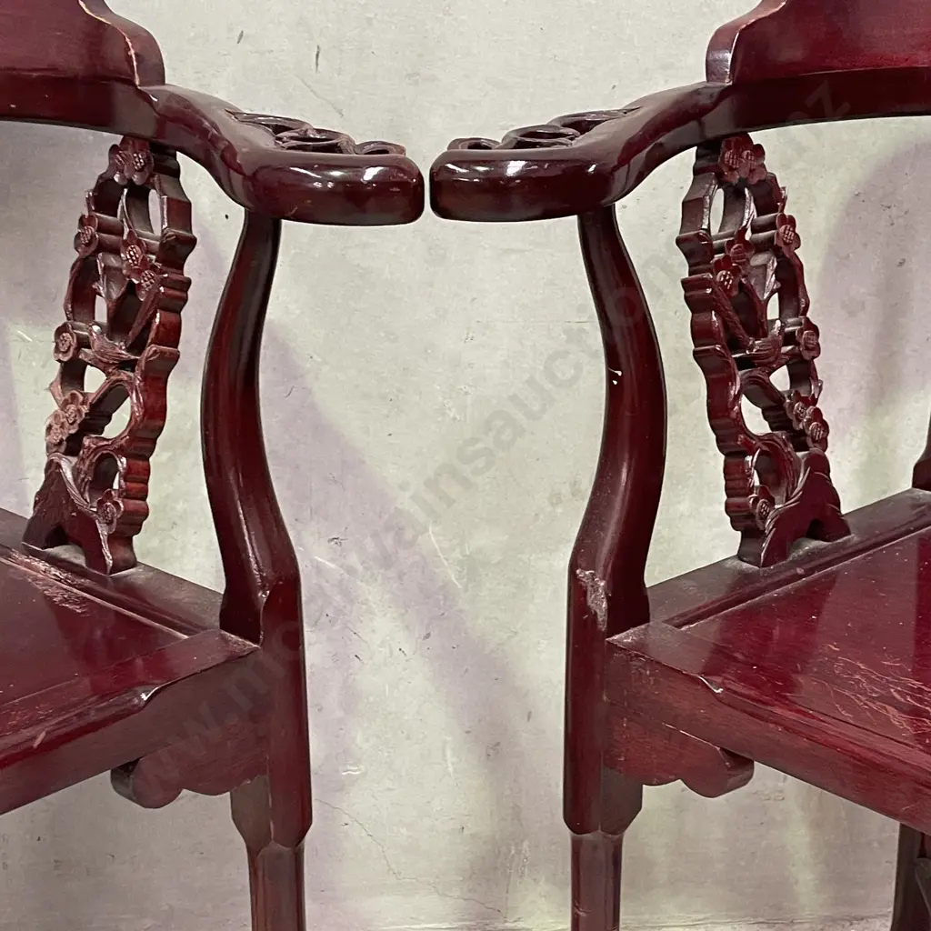 Pair of Vintage Chinese Rosewood Armchairs. Cross base with oval high back plate and intricately carved panels and arms. Image 1++