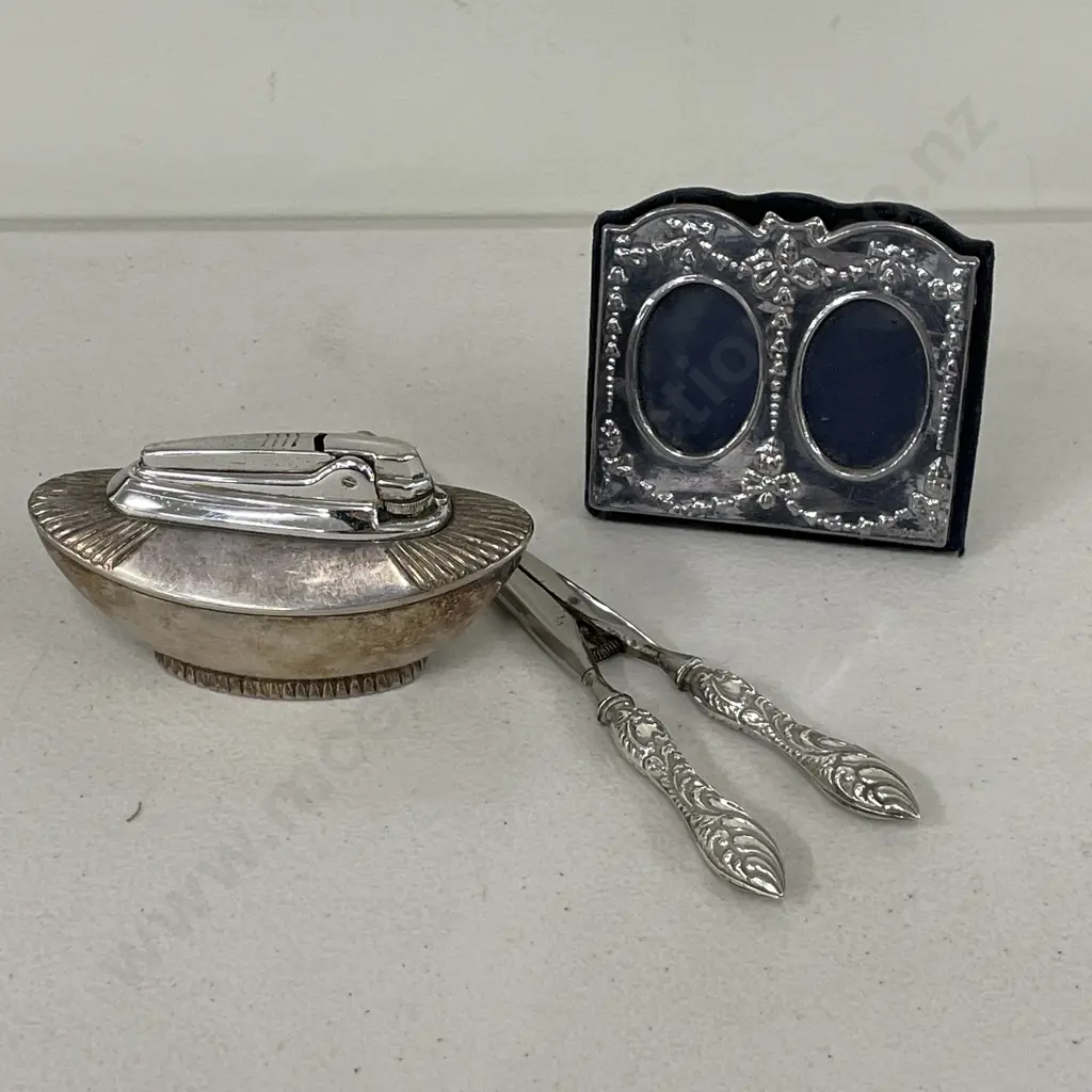 Collectable Silverware: Hallmarked Double Picture Frame, Ronsons Lighter and Sterling handled Tongs Image 1++