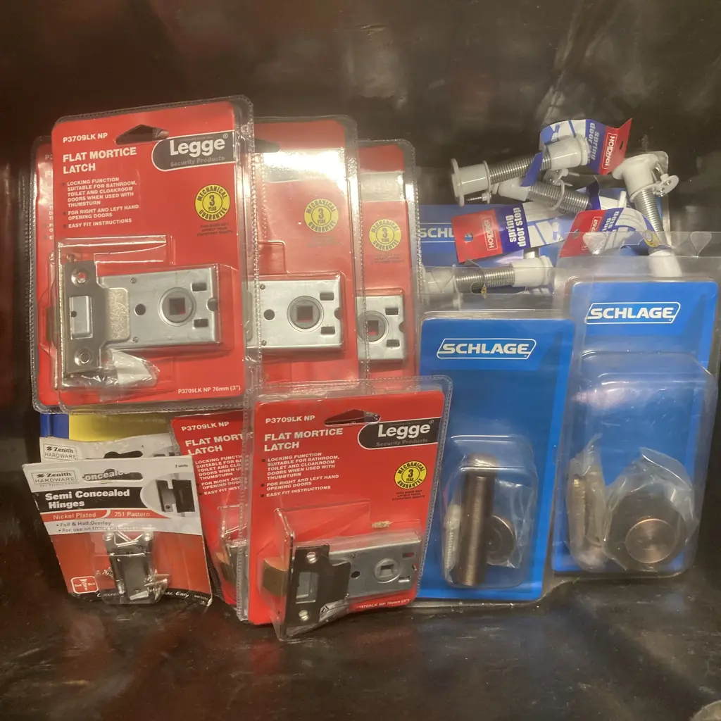 Black Bin of Assorted Packs of Legge & Schlage Hardware, Holdfast Door Stops Etc Image 1++