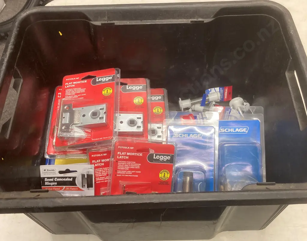 Black Bin of Assorted Packs of Legge & Schlage Hardware, Holdfast Door Stops Etc Image 1++