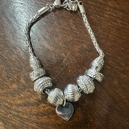 Silver Coloured Bracelet With Assorted Charms