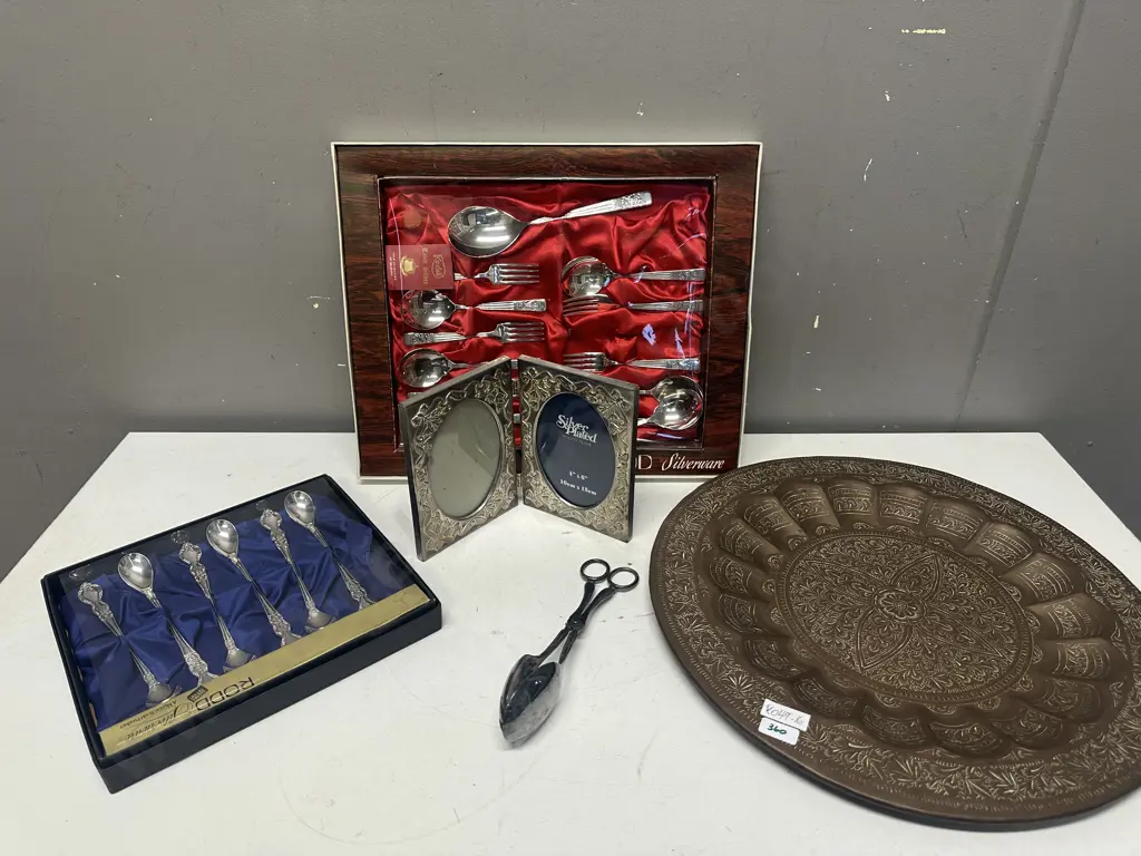 Selection Of Silverware With Copper Wall Plate Image 1++
