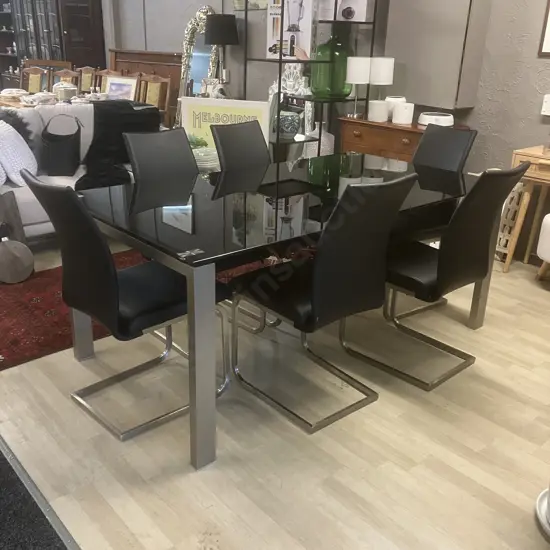 Black Glass Topped Rectangular Dining Table With 6 Black Leather Effect High Back Cantilever Chairs. H76 W180 D100cm