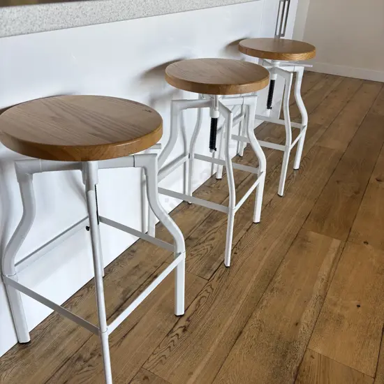 Set of Three Luca Lincoln Machinist Style White Adjustable Steel Barstools With Natural Round Wood Seats