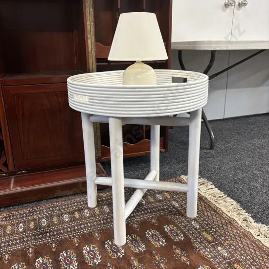 White Circular Rattan Tray Top Table (10 x 53cm) With Wooden Folding Base. 59 x 53cm and ceramic table lamp