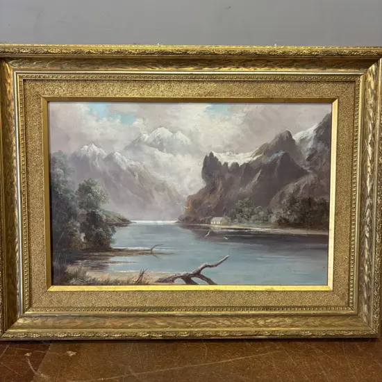 Unsigned Original on Canvas.  Mountain and river scene. Heavily gilded decorative frame. 82x61cm incl frame