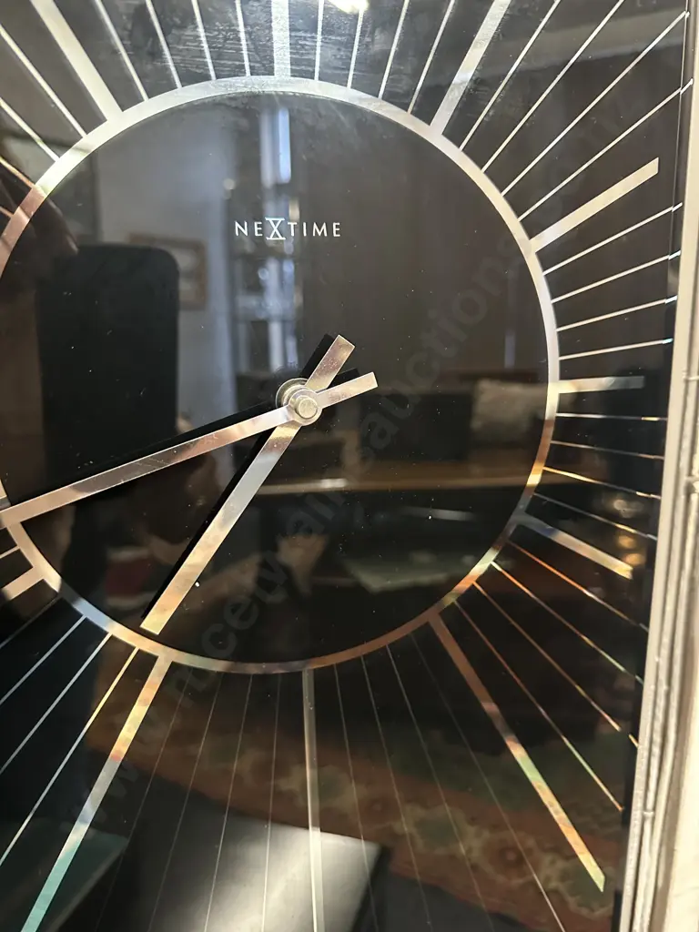 Modern Nextime Heavenly Wall Clock Black Glass With Silver Coloured Detail H70,W30cm. Image 1++