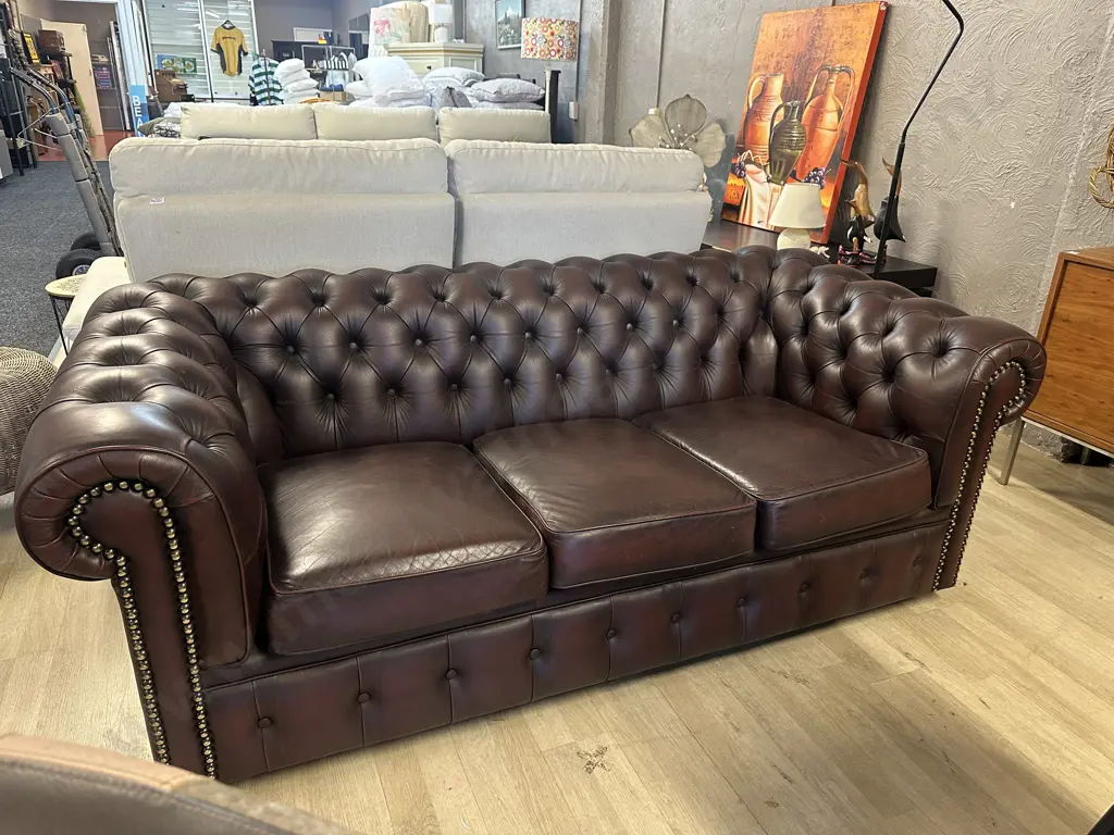Moran Leather Burgundy Three Seater Chesterfield Sofa Button Back, Rolled Armed With Dome Detail H75,W185,D90cm. Image 1++
