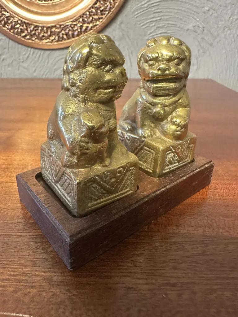 Pair Of Vintage Solid Brass Foo Dog Figurines On Wooden Plinth Image 1++