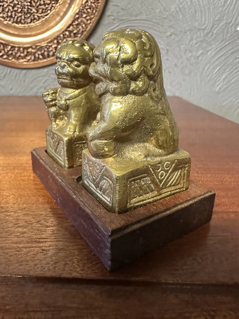 Pair Of Vintage Solid Brass Foo Dog Figurines On Wooden Plinth Image 1++