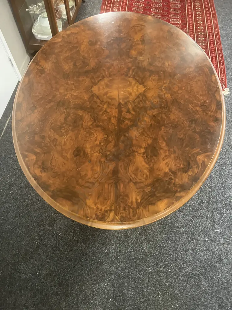Burr Walnut Victorian Oval Loo Table With Carved Base, White Porcelain Casters. H74 W133 D100cm Image 1++