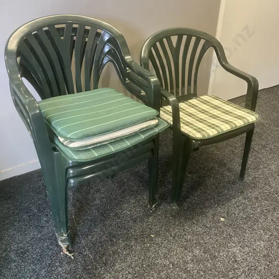 Four Green Plastic Stacking Chairs With Seat Cushions & Cover