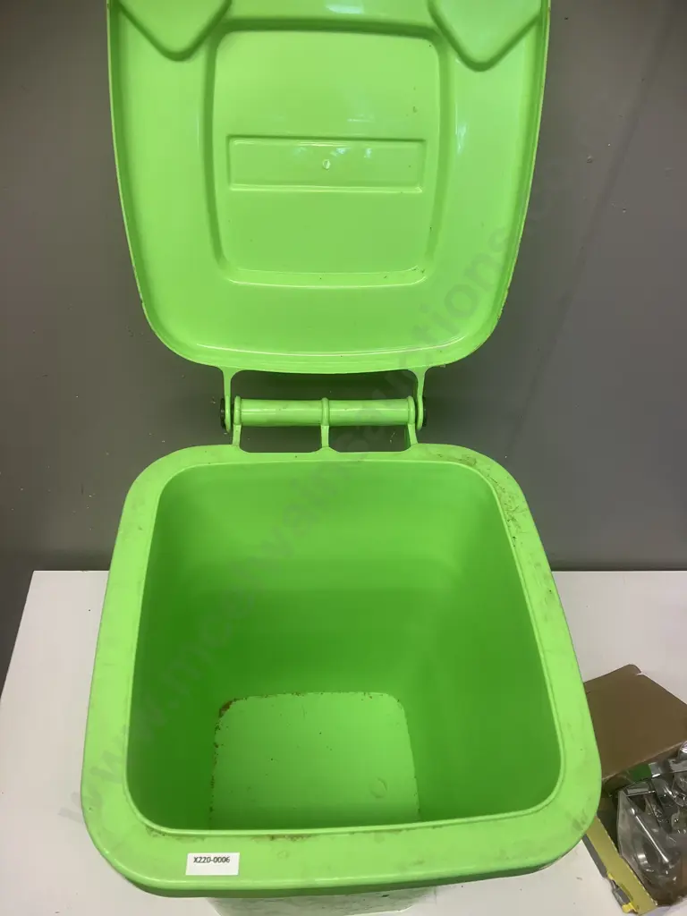 Small Green Bin With Assorted House Hardware Items Image 1++