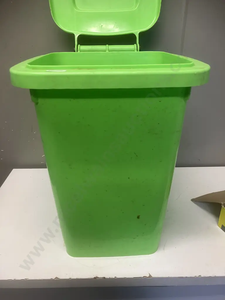 Small Green Bin With Assorted House Hardware Items Image 1++