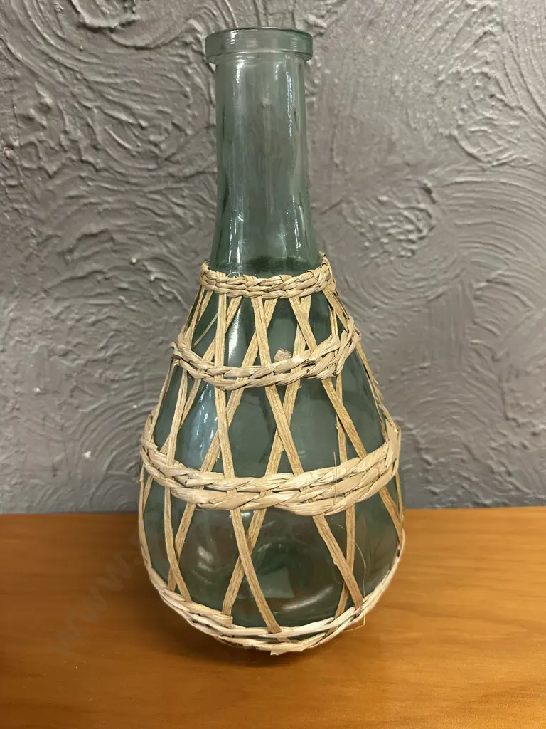 Vintage Green Glass Demijohn Bottle Wrapped In A Woven Wicker Detail H38cm. Image 1++