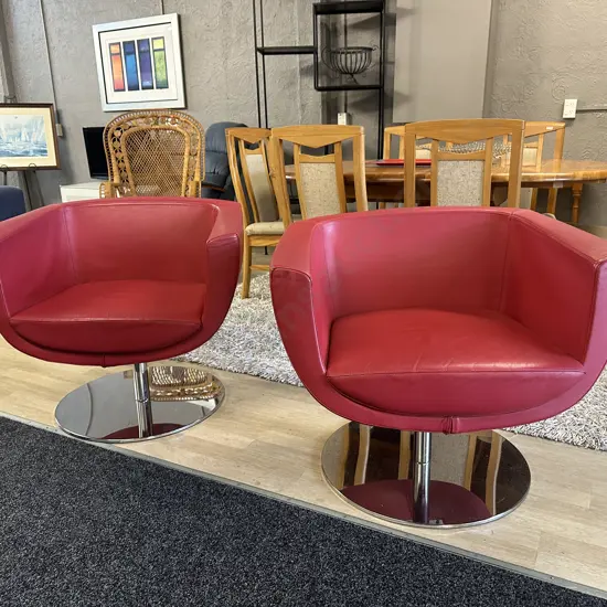 Pair Of Red Leather Tulip Shaped Arm Chairs On Round Chrome Bases W80cm.