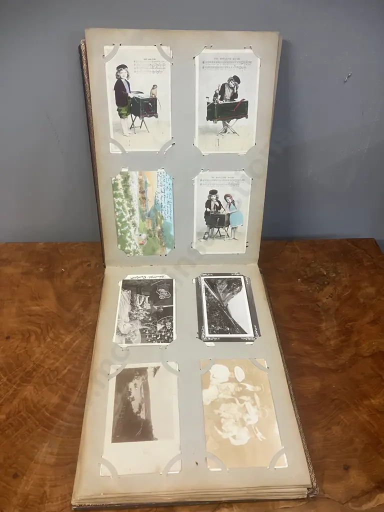 A Stunning Collection of 238 Early 1900's Postcards In A Black Lacquer Japanese Accordion Album Image 1++
