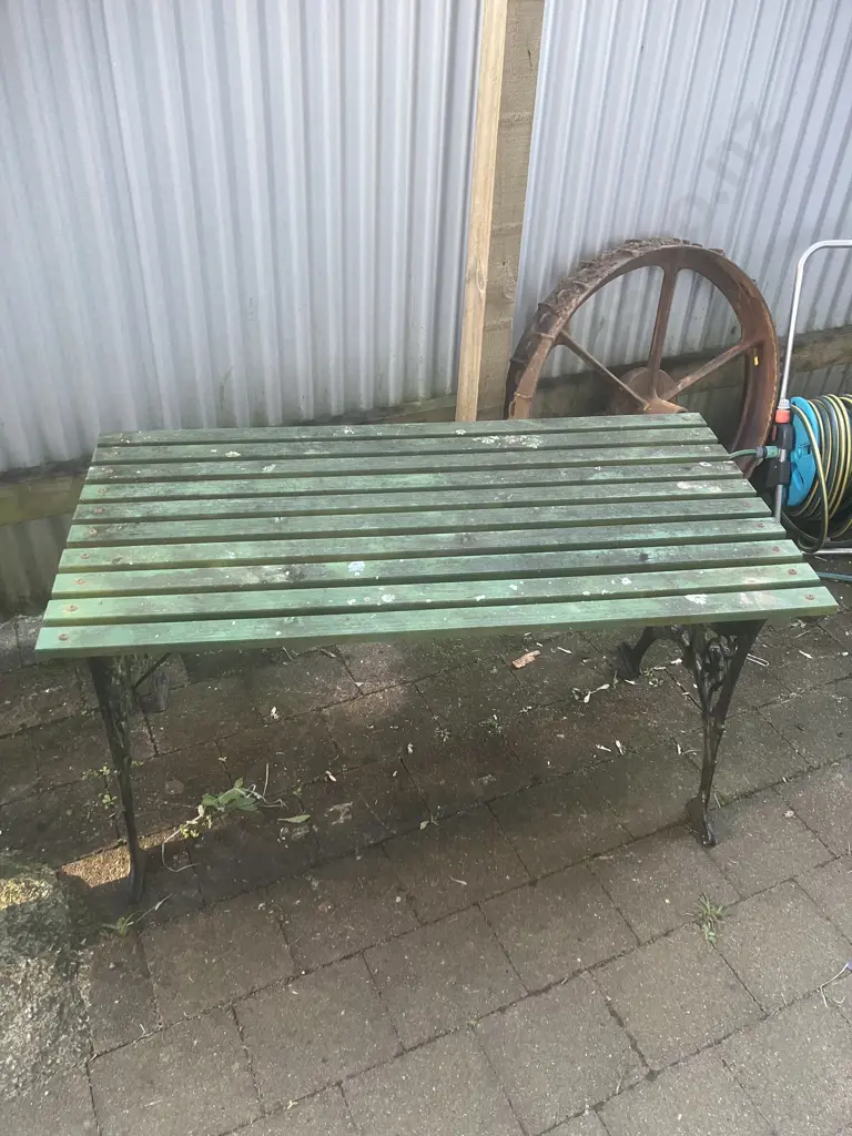 Black Steel Garden Table With Green Painted Wooden Slats. H64 W120 D62cm Image 1++