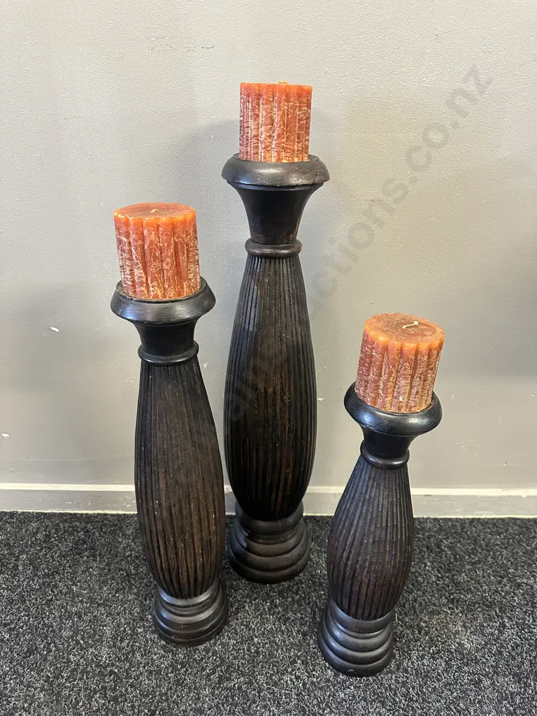 Set Of Three Wooden Candle Holders & Rust Coloured Candles Graduated Sizes 48-68cm. Image 1++