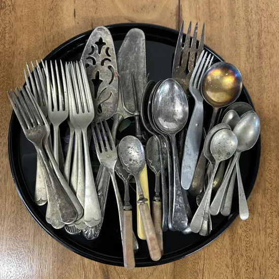 Selection Of Silverware Cutlery Items On Oriental Serving Tray