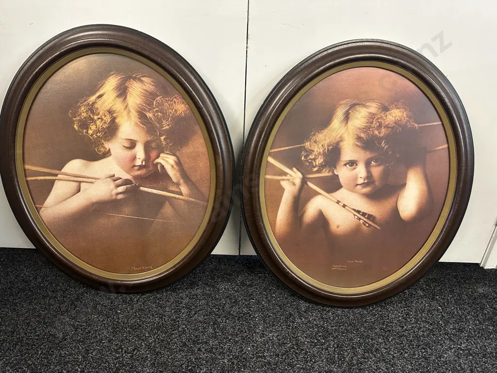 "Cupid Awake' & 'Cupid Asleep" Oval Mahogany Framed. 73 x 62cm Image 1++