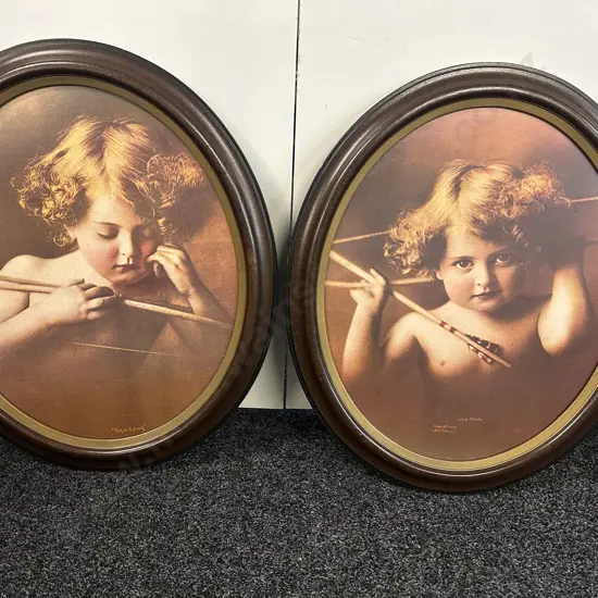 "Cupid Awake' & 'Cupid Asleep" Oval Mahogany Framed. 73 x 62cm