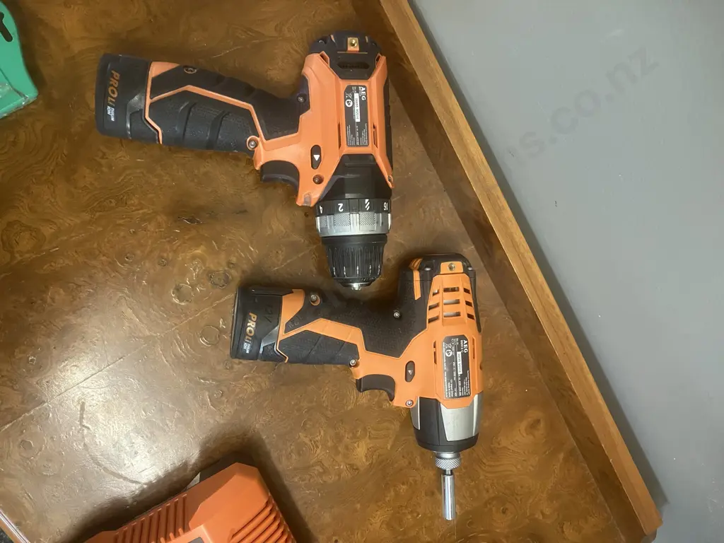 AEG 12V Ultra Compact 2-Speed Drill/Driver, Impact Driver, 2 x 2.0Ah Batteries, Charger & Evacut Drill Bits Image 1++
