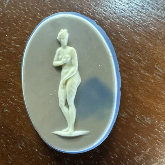 Wedgwood Oval Plaque of a Girl, White relief, Buff Ground, Blue Back Marked Wedgwood And Bentley - Late 18th. Century.