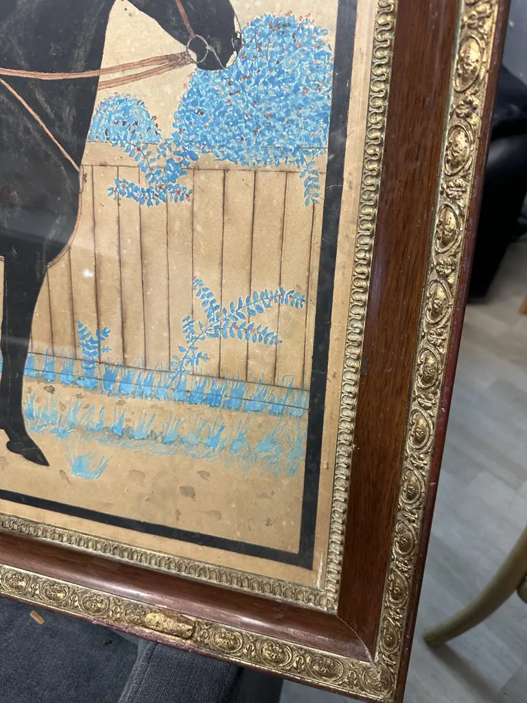 Gilt Framed Artwork Saddled Black Horse Standing In Front Of A Fence 67x87cm. Image 1++