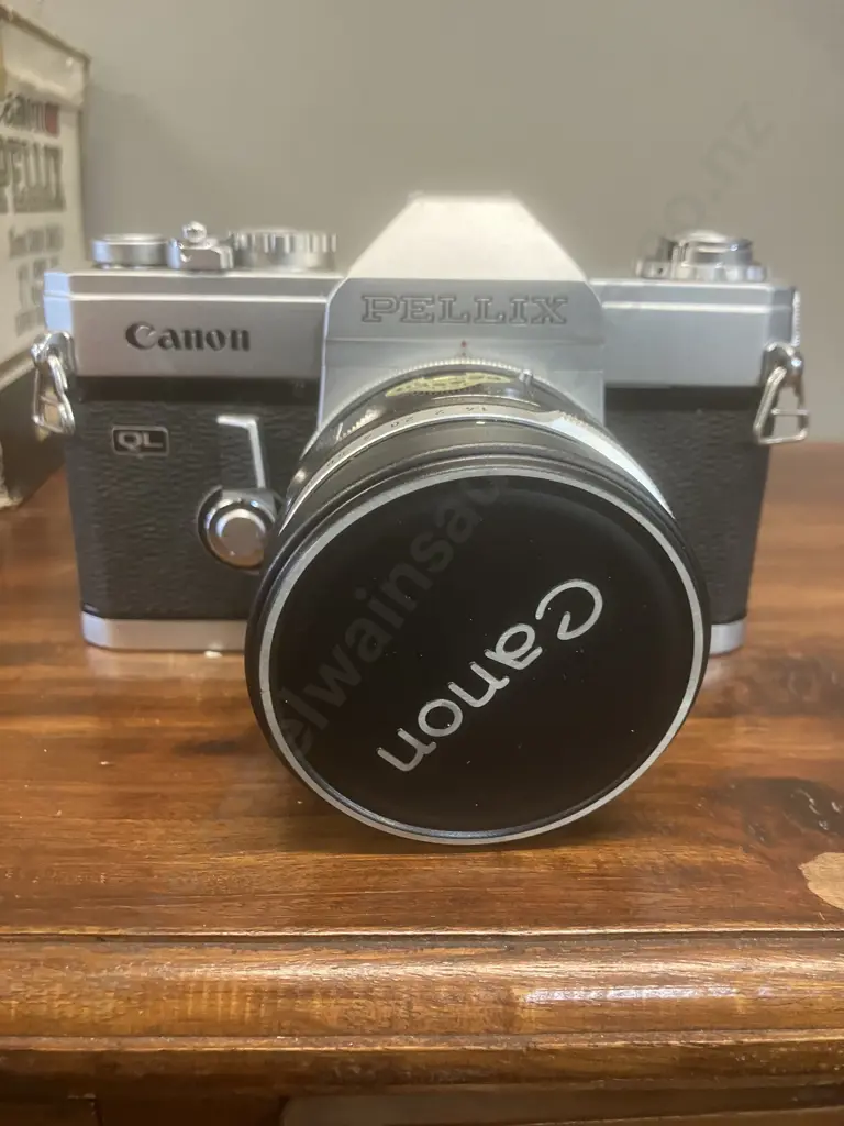Canon Pellix QL 35mm SLR Film Camera #157676 With a Canon FL 50mm f/1.4 Lens #163161, Japan 1966 Image 1++