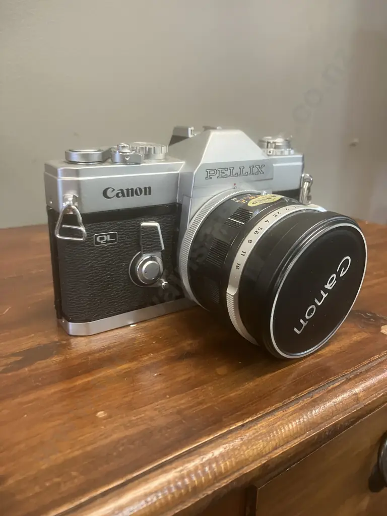 Canon Pellix QL 35mm SLR Film Camera #157676 With a Canon FL 50mm f/1.4 Lens #163161, Japan 1966 Image 1++