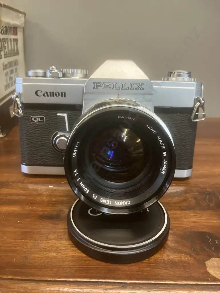 Canon Pellix QL 35mm SLR Film Camera #157676 With a Canon FL 50mm f/1.4 Lens #163161, Japan 1966 Image 1++