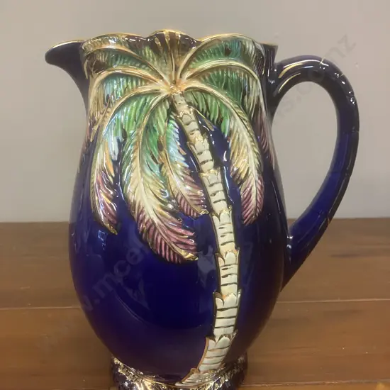 A Beswick Palm Tree Pattern Large Jug In Cobalt Blue With Gold Gilt Trim. H21cm