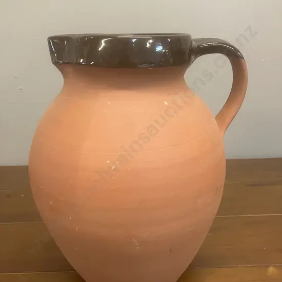 A 1960's C.H. Brannam Royal Barum Ware Red Clay Pitcher - England. H24cm