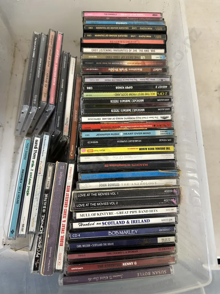 Clear Bin Of Assorted Cds Image 1++