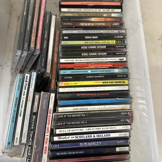 Clear Bin Of Assorted Cds