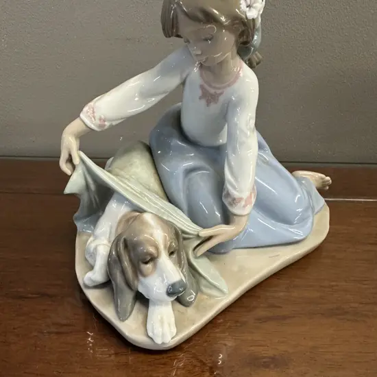 Lladro "Dog's Best Friend" Porcelain Figurine (#5688), Issued 1990 Retired 2005. H16cm.